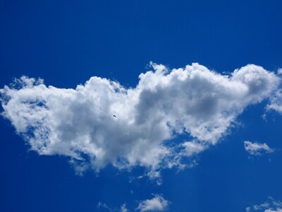 Blue clouds form white