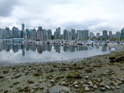 Skyline of Vancouver across the water with boats in British Columbia, Canada photo