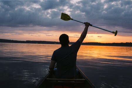 Boat sunset man photo
