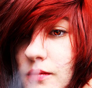 Eye rings red hair red eyes photo