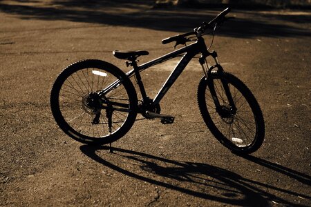 Asphalt bicycle dark photo