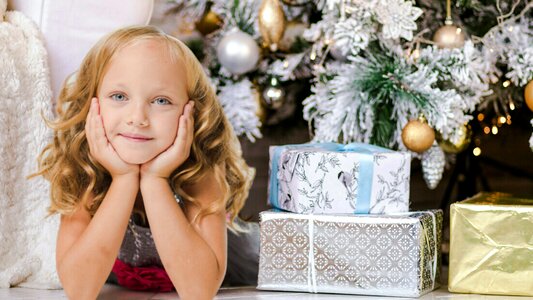 Little Girl with Her Presents on Christmas Eve photo