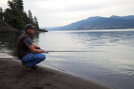 Fisherman on the Columbia River shore photo