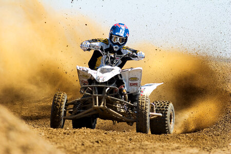 Quad Rider Driving in the Motocross Race photo