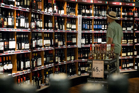 Man choosing wine in a wine store