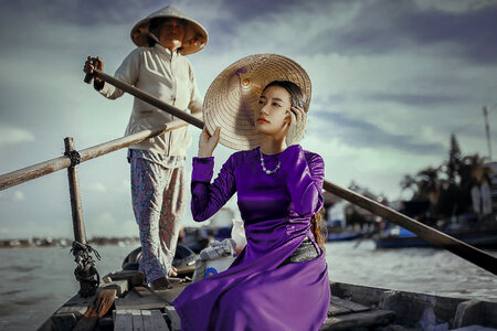 Asian Model in a Boat Wearing Conical Hat photo