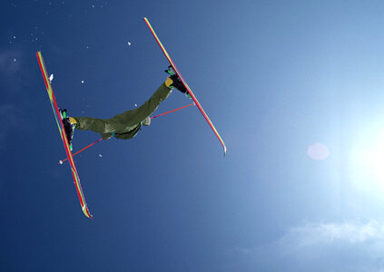 Jumping Skier in high mountains photo