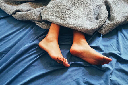Sleeping Feet in Bed photo