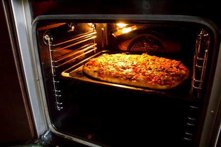 Pizza in oven photo