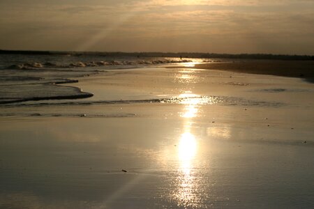 Reflection beach surf sunset photo