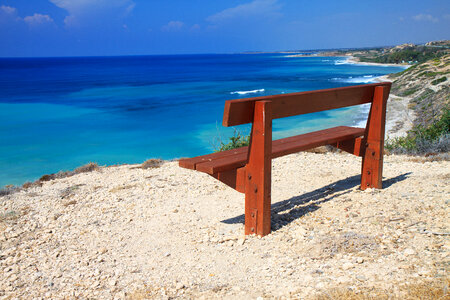 Bench by the coast in Cyprus photo