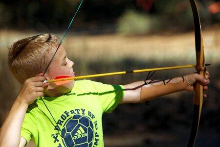Boy bow and arrow archery photo