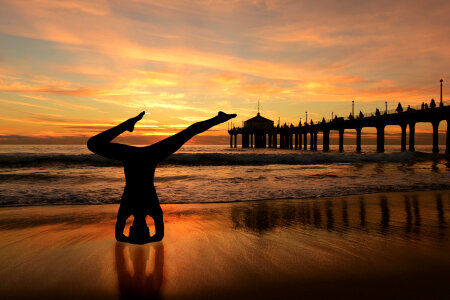 Yoga Pose Silhouette by the Sea photo
