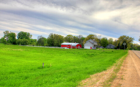 Farmhouse and barn in the landscape in Southern Wisconsin photo