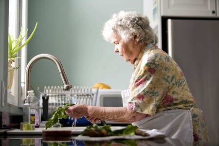 Cleaning cooking elderly photo