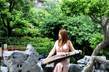 Asian Woman Play traditional Instrument photo