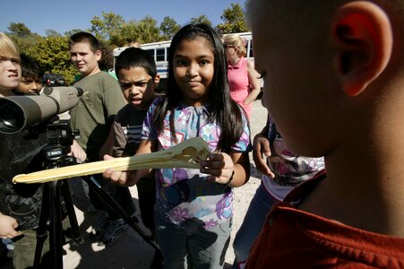 Female Child holding pelican