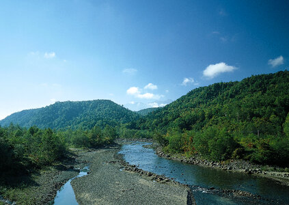 Beautiful mist landscapes with high mountains with stream