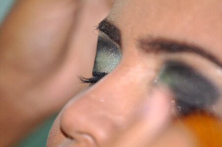 Woman shadows eyeliner