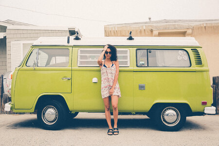 Woman Standing in front of Volkswagen Minibus photo
