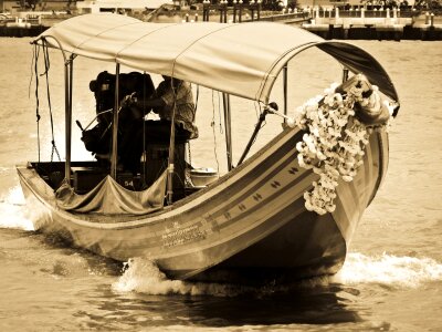 Traditional wooden boat for the transportation of passengers photo