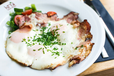 Crunchy sunny side up eggs with bacon photo