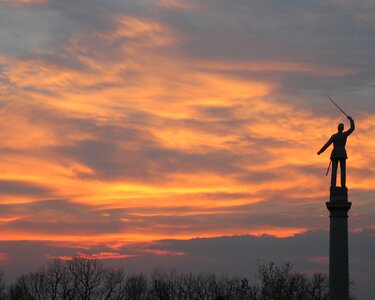 Clouds sunset monument photo