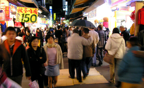 People in a busy night market in Taipei, Taiwan