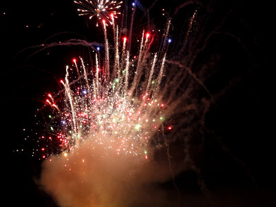 Smoke and fireworks and colorful sparks photo