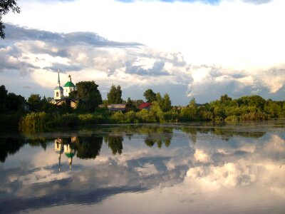 church reflecting in the water with sky