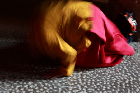 Blurry Picture Of Monk Praying photo