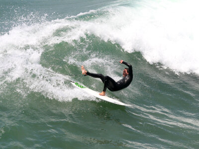Surfer On Blue Ocean Wave photo