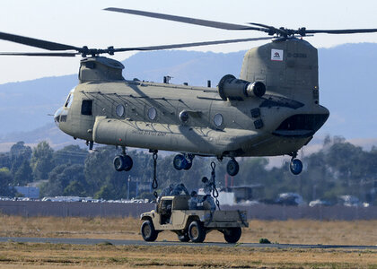 loading vehicles on a CH-47 Chinook cargo helicopter photo