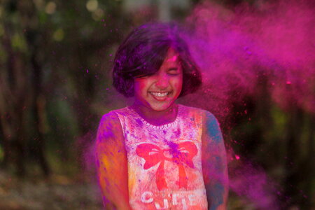 Young Girl Covered in Pink Powder
