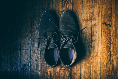 Black Velor Shoes on a Wooden Floor photo