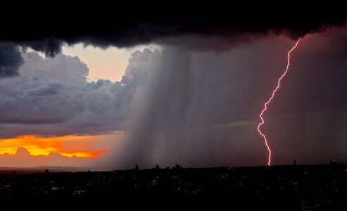 Evening Storm with Lightning over the City photo