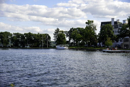 Boat on Green lake with clouds photo