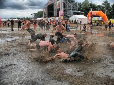 Dirty fun muddy people playing