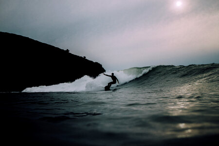 Silhouette Man Surfing Wave photo