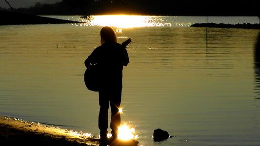 Silhouette twilight guitar photo
