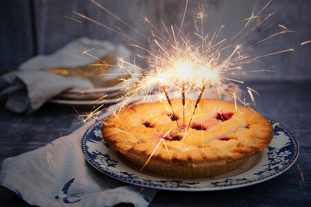 Birthday Pie with three sparklers as Candles photo