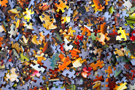 Randomly Scattered Colorful Puzzle Pieces Background
