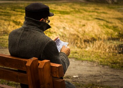 Old Man Reading Book Park Bench