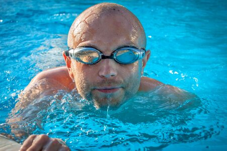 Young man swimming photo