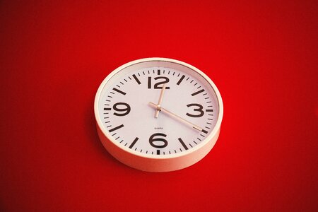 White Wall Clock Red Background photo
