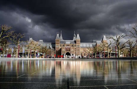 Building Architecture under dark clouds in Amsterdam, Netherlands photo