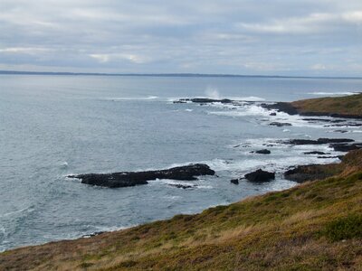 Blow hole island ocean photo