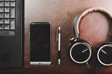 Laptop, Pen, Mobile and Music Headphones photo