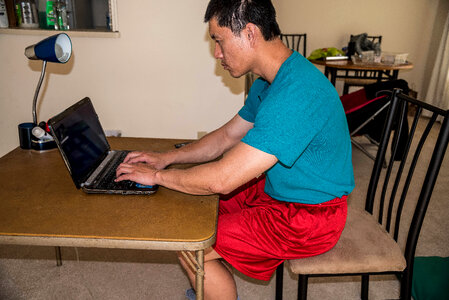Man working on laptop photo