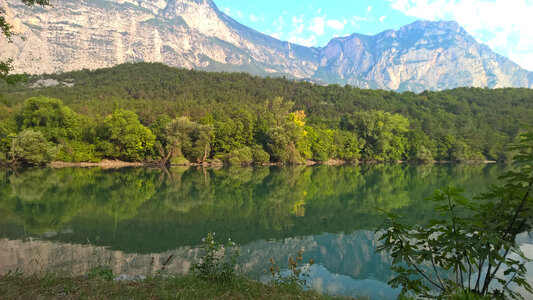 Nature landscape with trees, river, and mountains photo